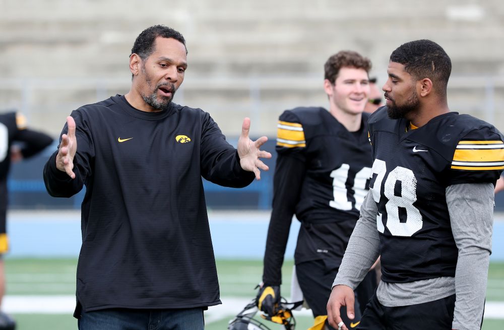Former Hawkeye Football player Quinn Early talks with running back Toren Young (28) following Holiday Bowl Practice No. 3  Tuesday, December 24, 2019 at San Diego Mesa College. (Brian Ray/hawkeyesports.com)