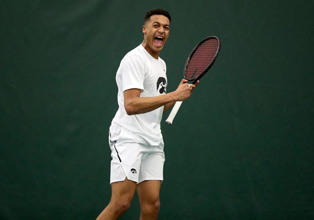 Iowa’s Oliver Okonkwo celebrates a point during his singles match at the Hawkeye Tennis and Recreation Complex in Iowa City on Sunday, February 16, 2020. (Stephen Mally/hawkeyesports.com)