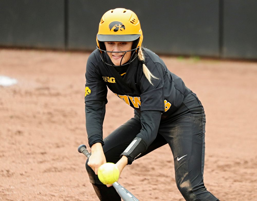 Iowa infielder Mia Ruther (26) lays down a bunt single which drives in a run during the fourth inning of their game against Iowa Softball vs Indian Hills Community College at Pearl Field in Iowa City on Sunday, Oct 6, 2019. (Stephen Mally/hawkeyesports.com)