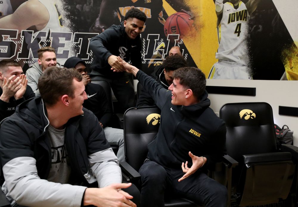 The Iowa Hawkeyes congratulate forward Luka Garza (55)  after finding out that he has been named the Big Ten Player of the Year Monday, March 9, 2020 at Carver-Hawkeye Arena. (Brian Ray/hawkeyesports.com)
