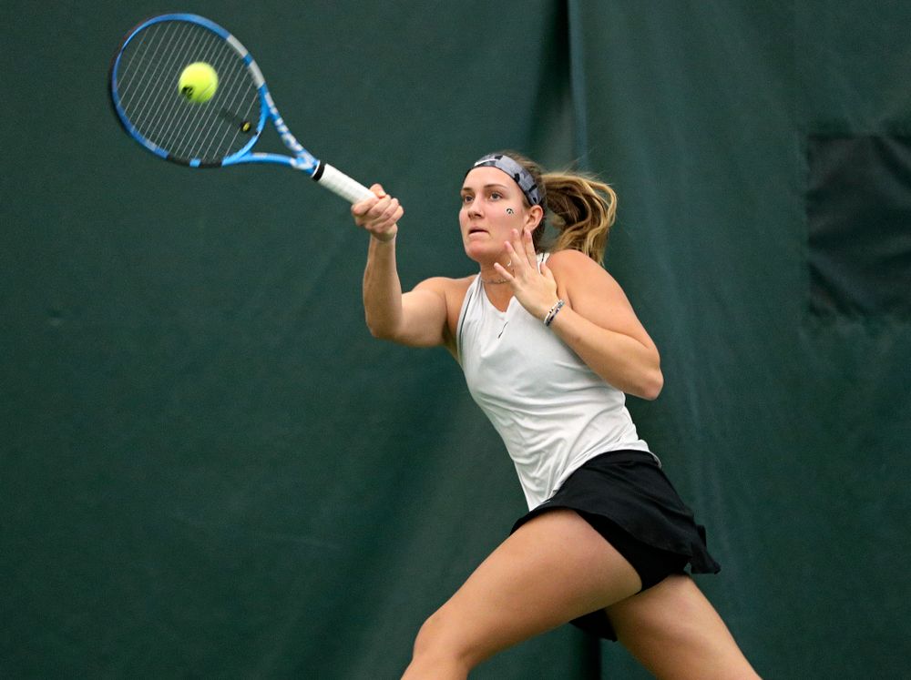 Iowa’s Ashleigh Jacobs returns a shot during her singles match at the Hawkeye Tennis and Recreation Complex in Iowa City on Sunday, February 16, 2020. (Stephen Mally/hawkeyesports.com)