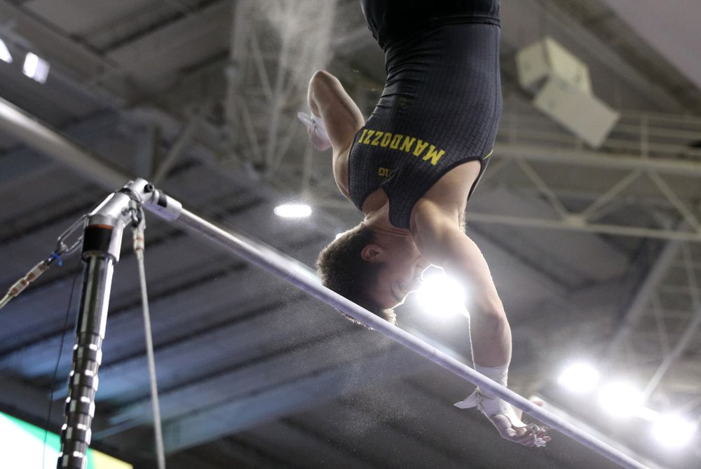 Iowa's Mitch Mandozzi competes on the high bar against the Ohio State Buckeyes Saturday, March 16, 2019 at Carver-Hawkeye Arena.  (Brian Ray/hawkeyesports.com)