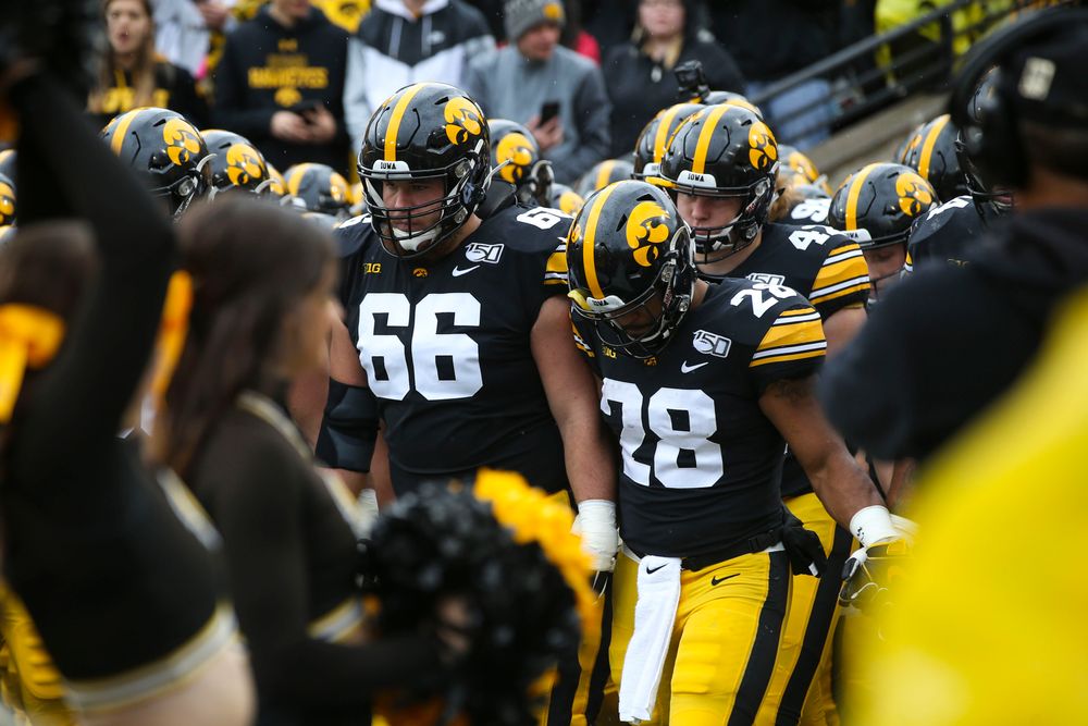 Iowa Hawkeyes offensive lineman Levi Paulsen (66) and  running back Toren Young (28) during Iowa football vs Purdue on Saturday, October 19, 2019 at Kinnick Stadium. (Lily Smith/hawkeyesports.com)