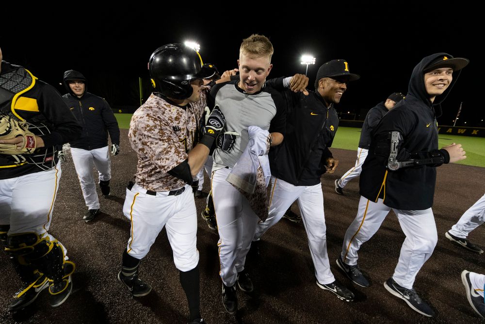 Iowa Hawkeyes Zeb Adreon (5) celebrates with his teammates after driving in the game winning run in the bottom of the 9th against the Nebraska Cornhuskers on Military Appreciation Night Friday, April 19, 2019 at Duane Banks Field. (Brian Ray/hawkeyesports.com)