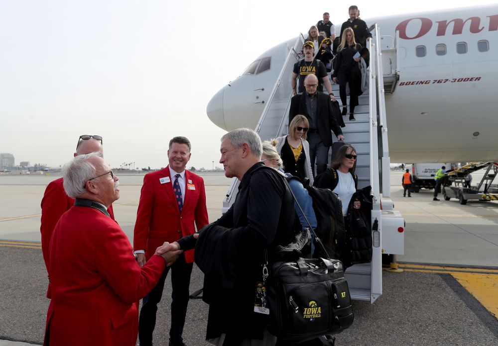 Iowa Hawkeyes head coach Kirk Ferentz shakes hands with the ÒRed CoatsÓ after arriving in San Diego, CA Saturday, December 21, 2019 for the Holiday Bowl. (Brian Ray/hawkeyesports.com)
