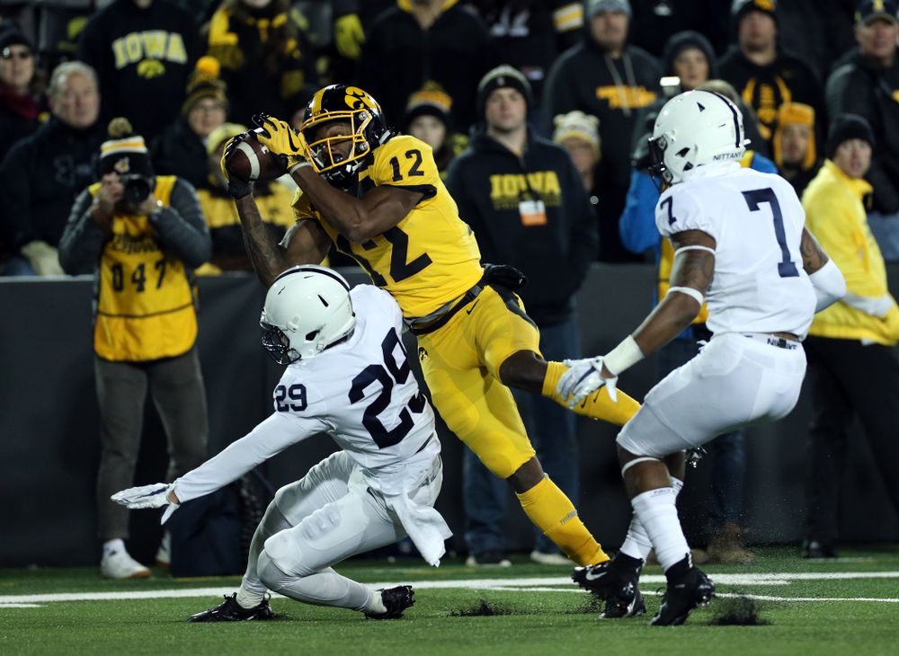 Iowa Hawkeyes wide receiver Brandon Smith (12) catches a touchdown pass against the Penn State Nittany Lions Saturday, October 12, 2019 at Kinnick Stadium. (Brian Ray/hawkeyesports.com)