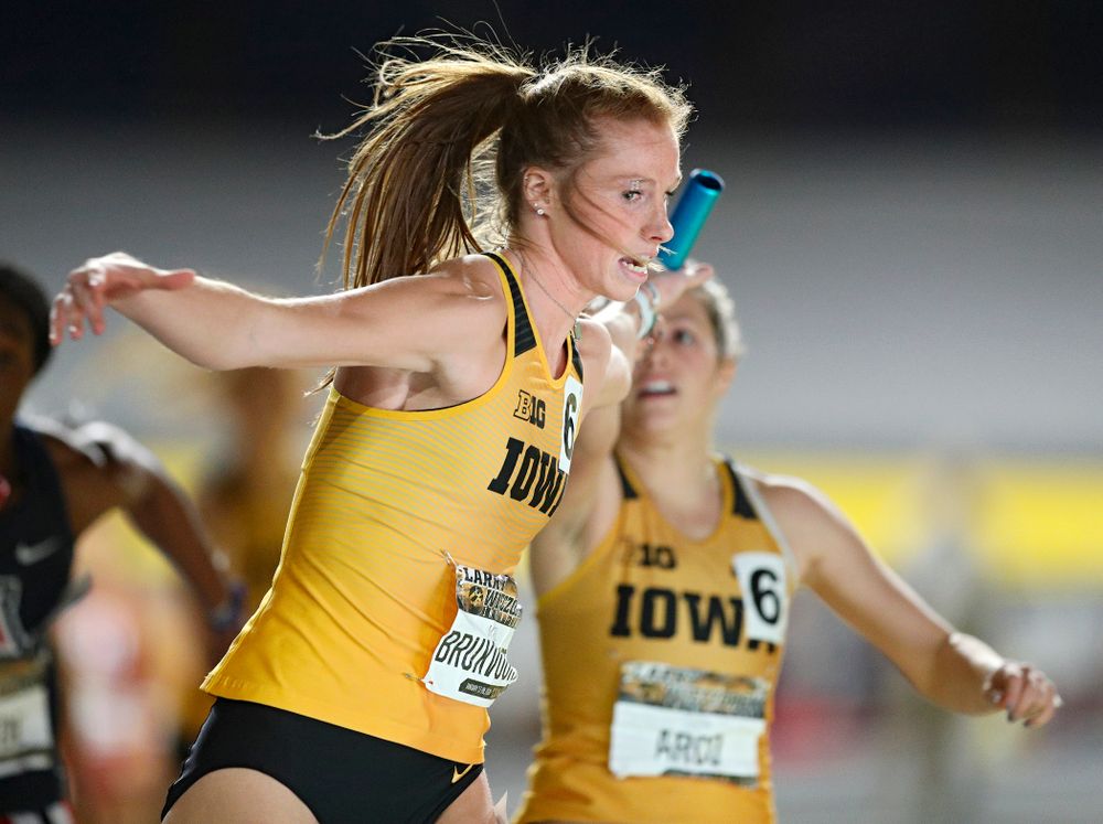 Iowa’s Mariel Bruxvoort (from left) takes the baton from Taylor Arco as they run the women’s 1600 meter relay event during the Larry Wieczorek Invitational at the Recreation Building in Iowa City on Saturday, January 18, 2020. (Stephen Mally/hawkeyesports.com)