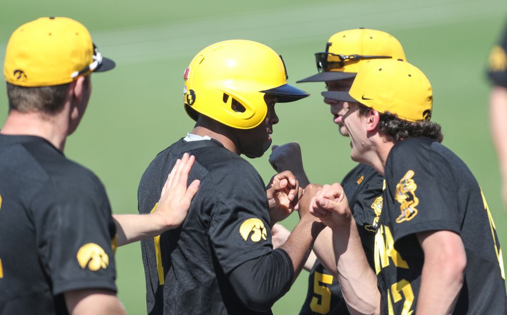 Iowa Hawkeyes infielder Lorenzo Elion (1) celebrates with his teammates after scoring during game two against UC Irvine Saturday, May 4, 2019 at Duane Banks Field. (Brian Ray/hawkeyesports.com)