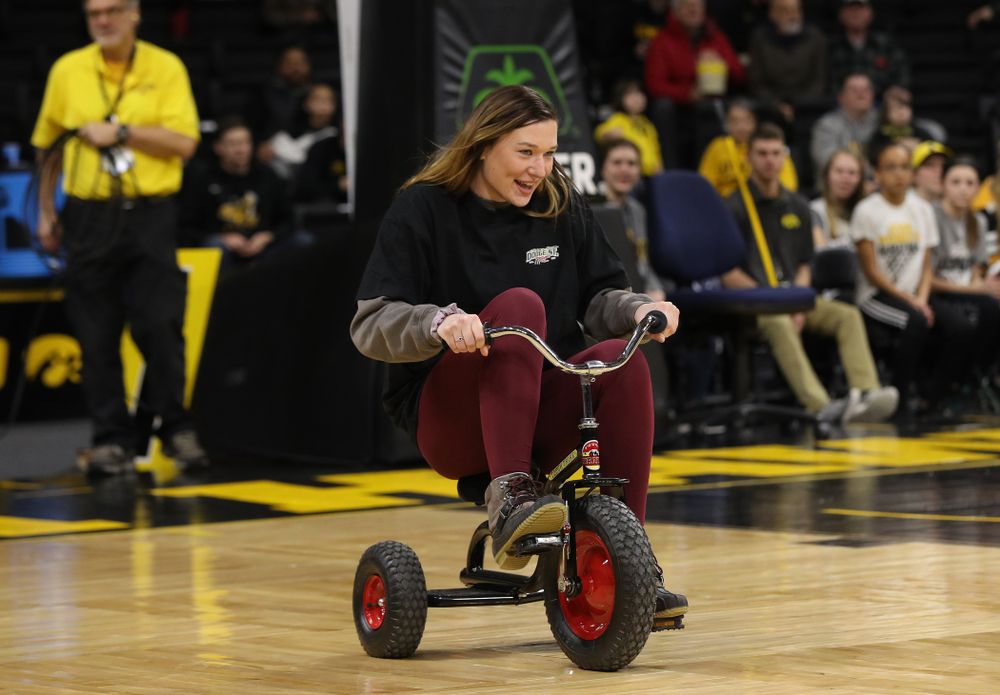 Fans race tricycles on the court during the Iowa Hawkeyes game against the Rutgers Scarlet Knights Wednesday, January 23, 2019 at Carver-Hawkeye Arena. (Brian Ray/hawkeyesports.com)