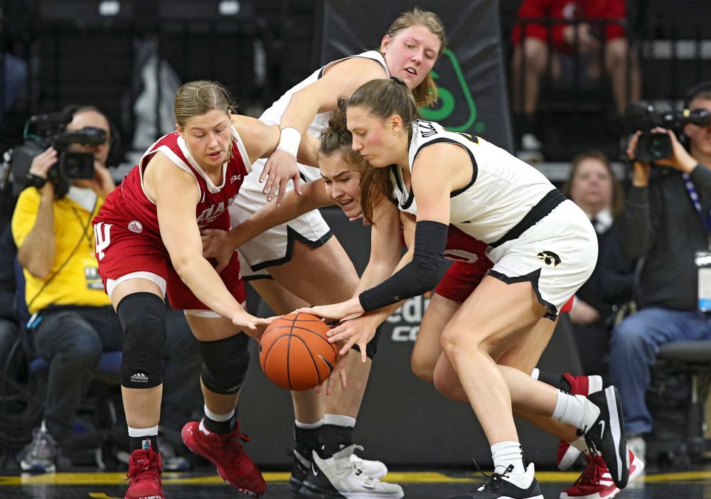 Iowa Hawkeyes forward Amanda Ollinger (43) tries to grab a loose ball as forward Monika Czinano (25) looks on during the second quarter of their game at Carver-Hawkeye Arena in Iowa City on Sunday, January 12, 2020. (Stephen Mally/hawkeyesports.com)