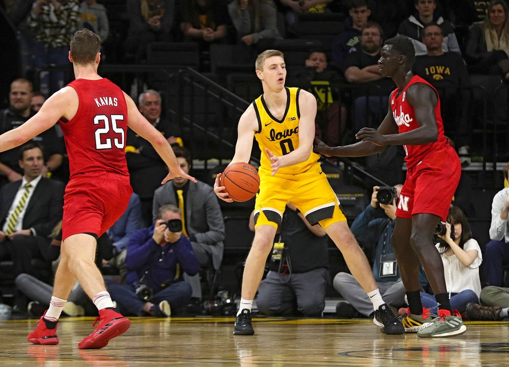 Iowa Hawkeyes forward Michael Baer (0) looks to pass during the second half of their game at Carver-Hawkeye Arena in Iowa City on Saturday, February 8, 2020. (Stephen Mally/hawkeyesports.com)
