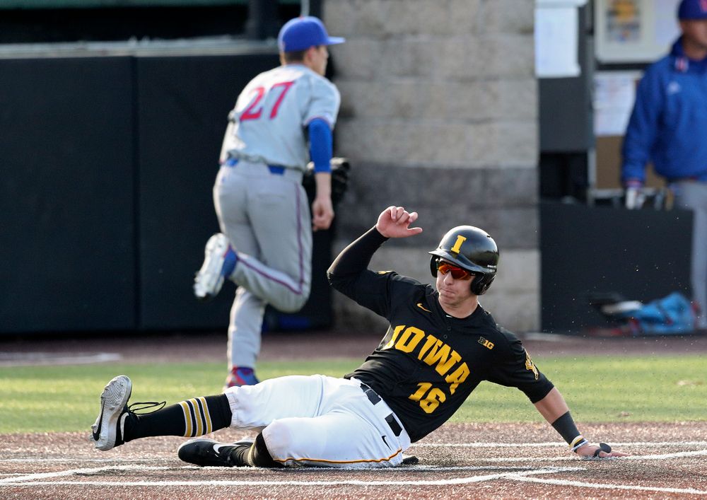 Iowa catcher Tyler Snep (16) scores a run during the fourth inning of their college baseball game at Duane Banks Field in Iowa City on Tuesday, March 10, 2020. (Stephen Mally/hawkeyesports.com)