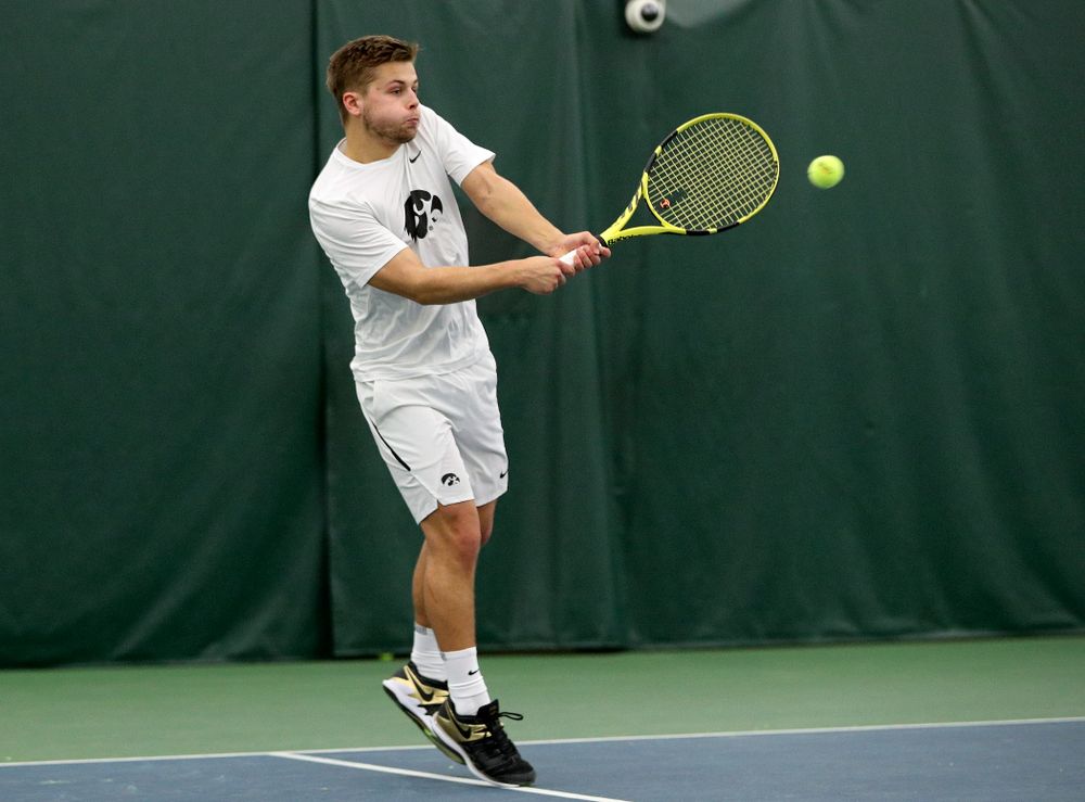 Iowa’s Will Davies returns a shot during his doubles match at the Hawkeye Tennis and Recreation Complex in Iowa City on Sunday, February 16, 2020. (Stephen Mally/hawkeyesports.com)