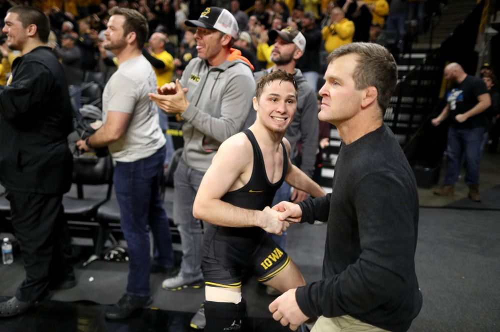 IowaÕs Spencer Lee cheers on teammate Austin DeSanto as he wrestles WisconsinÕs  Seth Gross at 133 pounds Sunday, December 1, 2019 at Carver-Hawkeye Arena. DeSanto won the match 6-2. (Brian Ray/hawkeyesports.com)