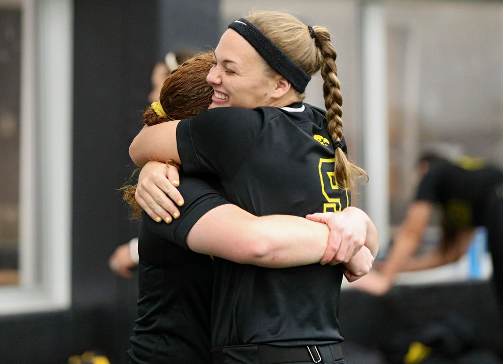Iowa catcher/infielder Kate Claypool (from left) hugs utility player/catcher Abby Lien (9) during Iowa Softball Media Day at the Hawkeye Tennis and Recreation Complex in Iowa City on Thursday, January 30, 2020. (Stephen Mally/hawkeyesports.com)
