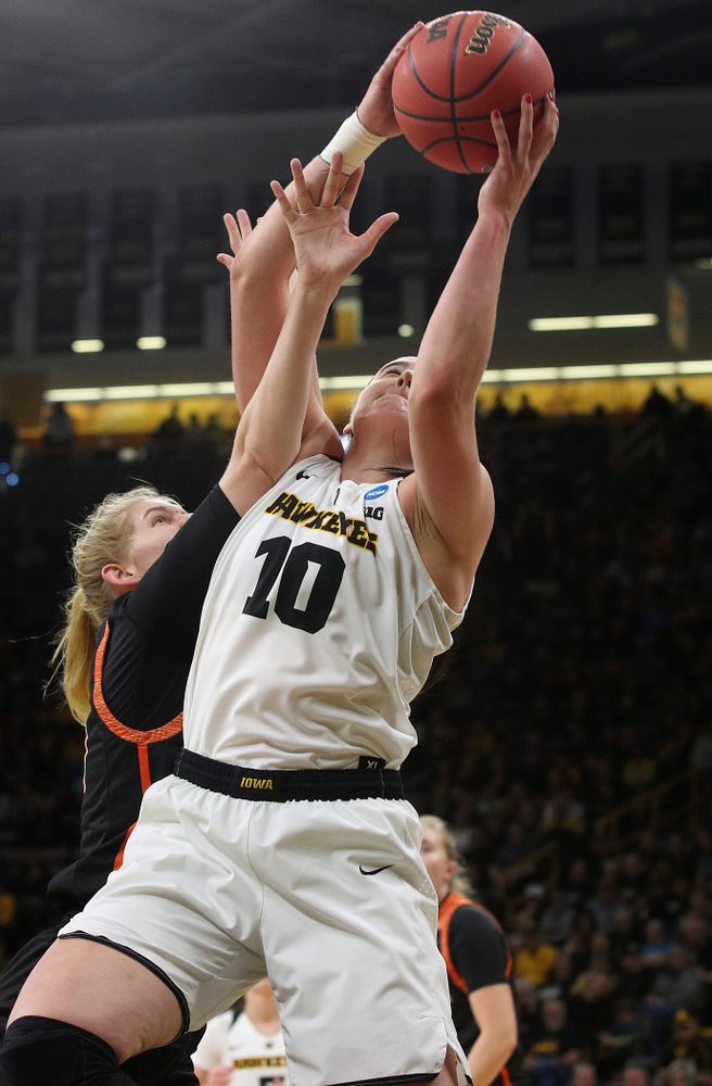 Iowa Hawkeyes forward Megan Gustafson (10) pulls in a rebound during the first round of the 2019 NCAA Women's Basketball Tournament at Carver Hawkeye Arena in Iowa City on Friday, Mar. 22, 2019. (Stephen Mally for hawkeyesports.com)