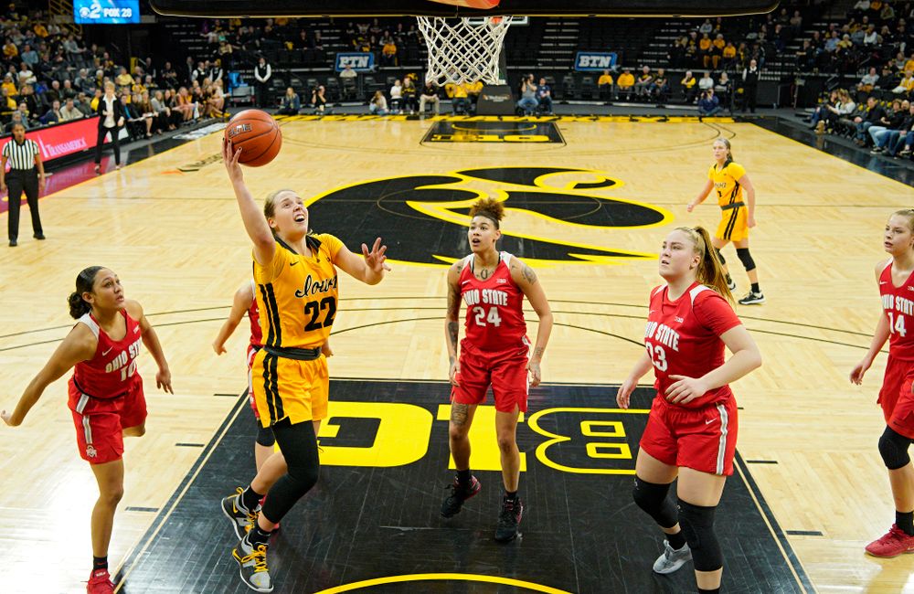 Iowa Hawkeyes guard Kathleen Doyle (22) scores a basket inside of all five Ohio State Buckeyes players during the second quarter of their game at Carver-Hawkeye Arena in Iowa City on Thursday, January 23, 2020. (Stephen Mally/hawkeyesports.com)