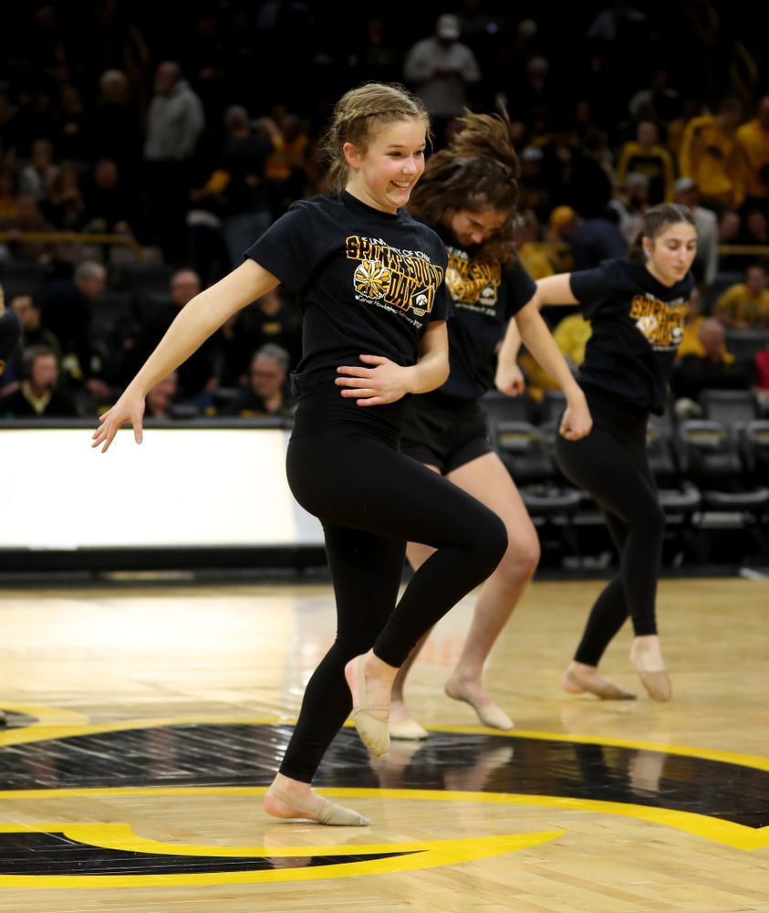The Iowa Spirit Squad performs with participants in Spirit Squad Day at halftime of the Iowa Hawkeyes game against the Nebraska Cornhuskers Saturday, February 8, 2020 at Carver-Hawkeye Arena. (Brian Ray/hawkeyesports.com)