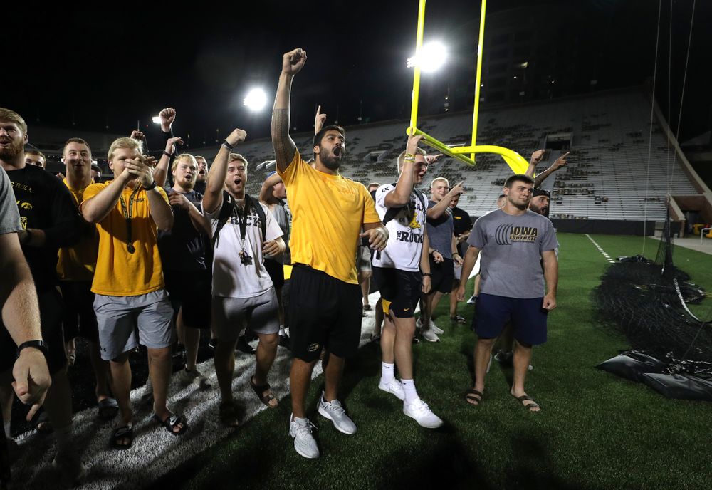 Members o the Iowa Football Team cheer on the new players as they sing the ÒFight SongÓ  Thursday, August 22, 2019 at Kinnick Stadium in Iowa City. (Brian Ray/hawkeyesports.com)