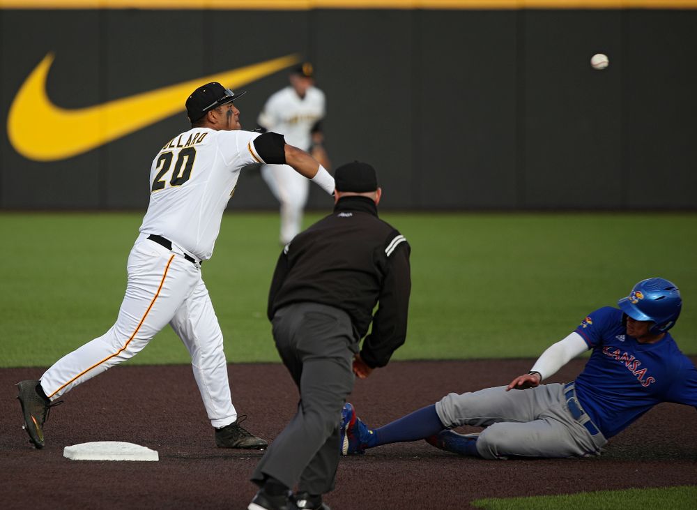 Iowa infielder Izaya Fullard (20) throws to first base as they turn a double play during the eighth inning of their college baseball game at Duane Banks Field in Iowa City on Wednesday, March 11, 2020. (Stephen Mally/hawkeyesports.com)