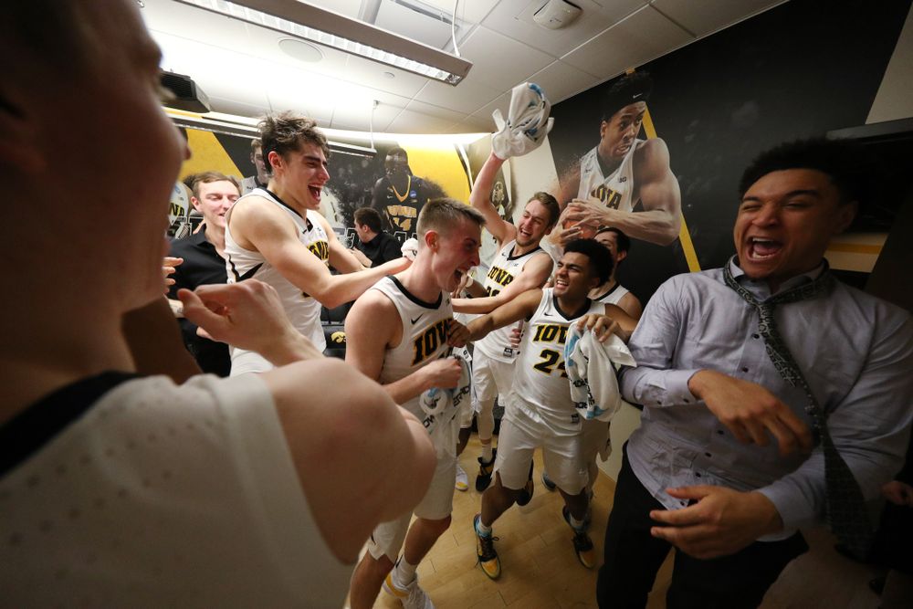 Iowa Hawkeyes guard Joe Wieskamp (10) is mobbed by his teammates in the locker after their victory over the Michigan Wolverines Friday, February 1, 2019 at Carver-Hawkeye Arena. (Brian Ray/hawkeyesports.com)