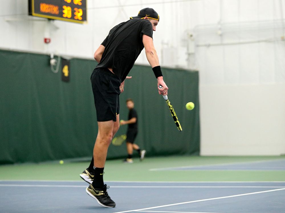 Iowa’s Joe Tyler returns a shot during his singles match at the Hawkeye Tennis and Recreation Complex in Iowa City on Friday, February 14, 2020. (Stephen Mally/hawkeyesports.com)
