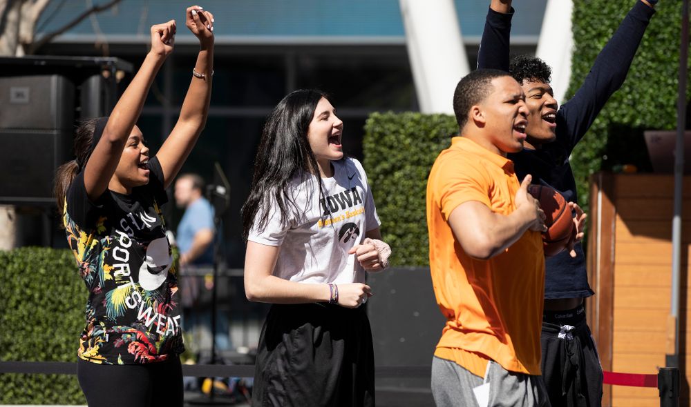 Iowa Hawkeyes forward Megan Gustafson (10) cheers on the athletes during a Special Olympics Event Friday, April 12, 2019 in the XBOX Plaza at LA Live.  (Brian Ray/hawkeyesports.com)