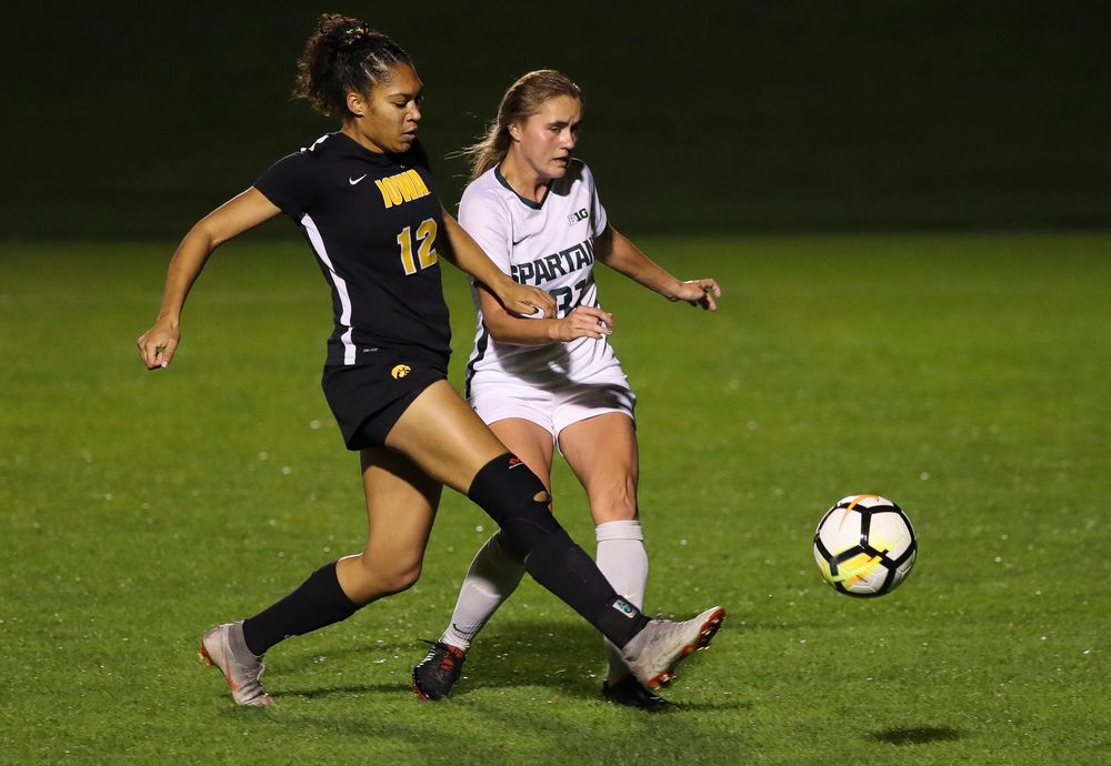 Iowa Hawkeyes forward Olivia Fiegel (12) fights for possession during a game against Michigan State at the Iowa Soccer Complex on October 12, 2018. (Tork Mason/hawkeyesports.com)