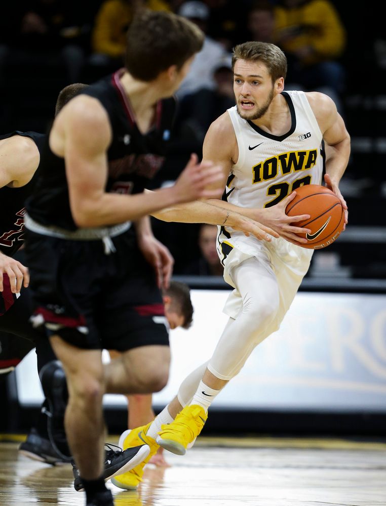 Iowa Hawkeyes forward Riley Till (20) brings the ball upcourt during a game against Guilford College at Carver-Hawkeye Arena on November 4, 2018. (Tork Mason/hawkeyesports.com)