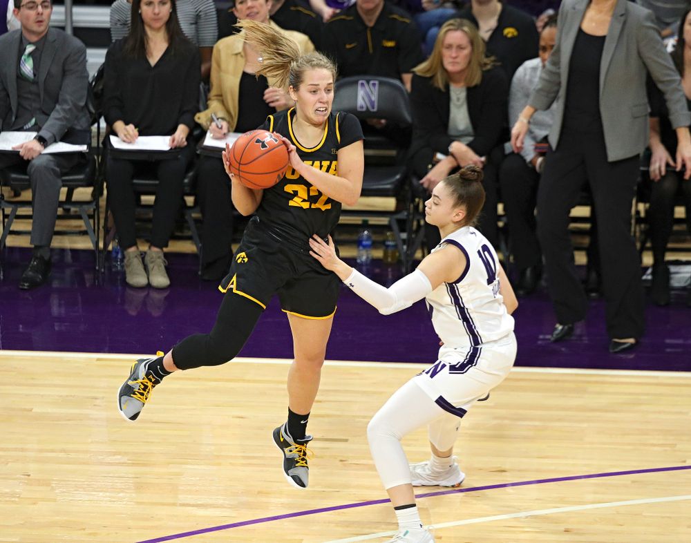 Iowa Hawkeyes guard Kathleen Doyle (22) pulls in a pass during the fourth quarter of their game at Welsh-Ryan Arena in Evanston, Ill. on Sunday, January 5, 2020. (Stephen Mally/hawkeyesports.com)