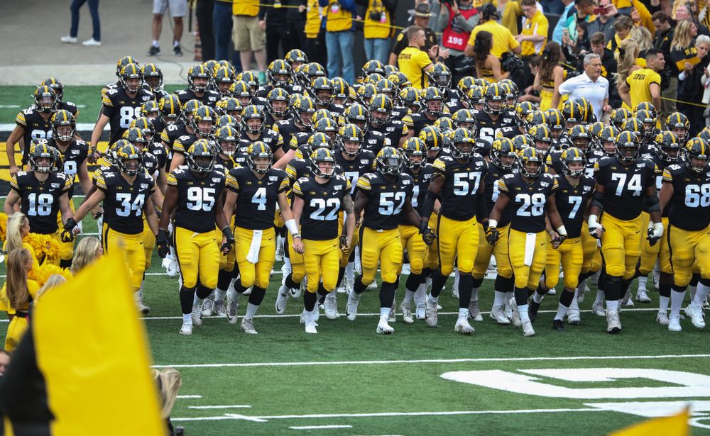 The Iowa Hawkeyes swarm onto the field for their game against Middle Tennessee State Saturday, September 28, 2019 at Kinnick Stadium. (Max Allen/hawkeyesports.com)