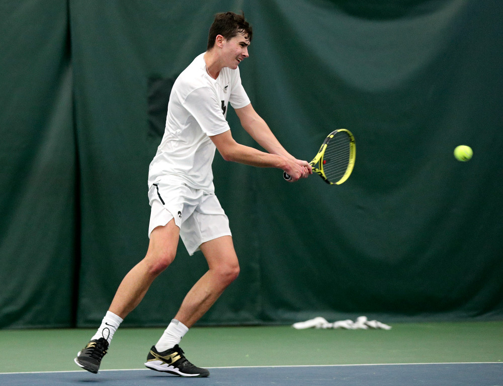 Iowa’s Matt Clegg returns a shot during his doubles match at the Hawkeye Tennis and Recreation Complex in Iowa City on Sunday, February 16, 2020. (Stephen Mally/hawkeyesports.com)