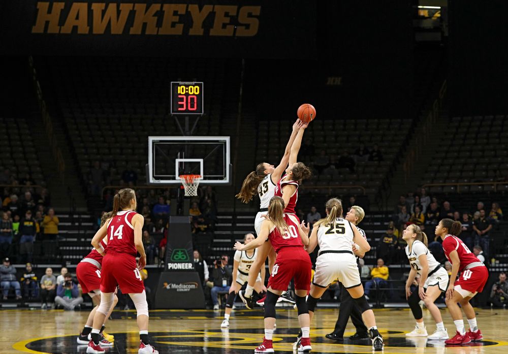 Iowa Hawkeyes forward Amanda Ollinger (43) wins the opening tip off during the first quarter of their game at Carver-Hawkeye Arena in Iowa City on Sunday, January 12, 2020. (Stephen Mally/hawkeyesports.com)