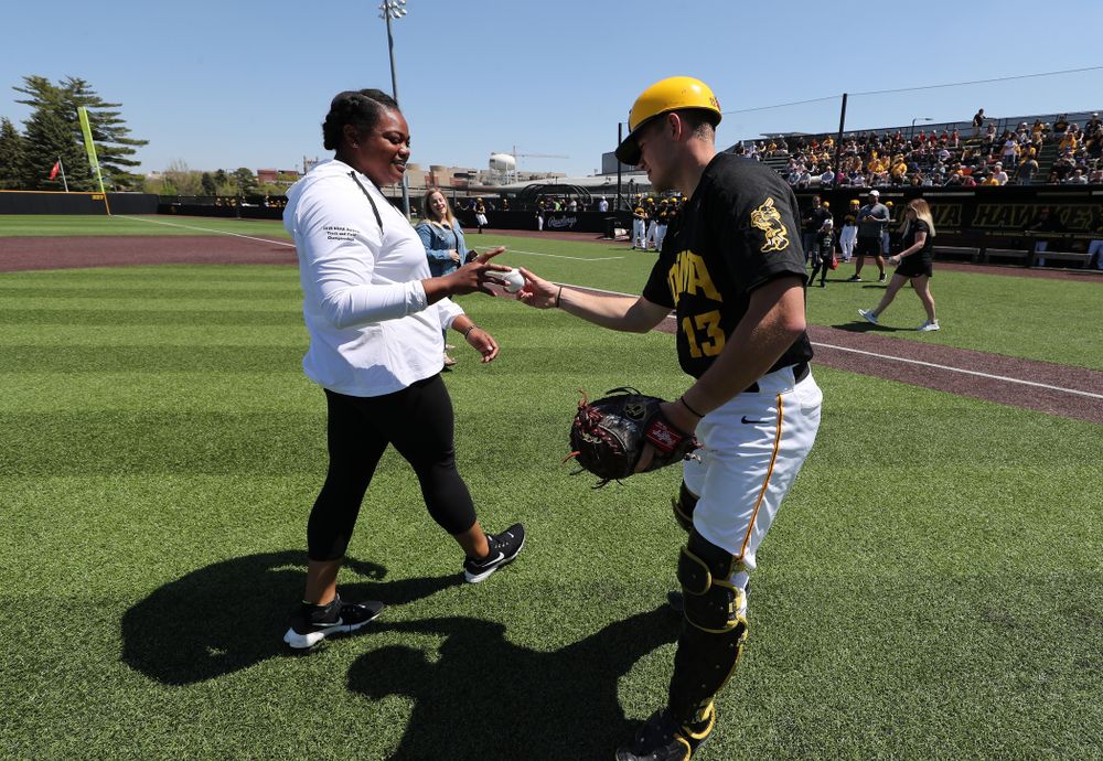 Iowa Track and FieldÕs Laulauga Tausaga throws out a first pitch before the Iowa Hawkeyes second game against UC Irvine Saturday, May 4, 2019 at Duane Banks Field. (Brian Ray/hawkeyesports.com)