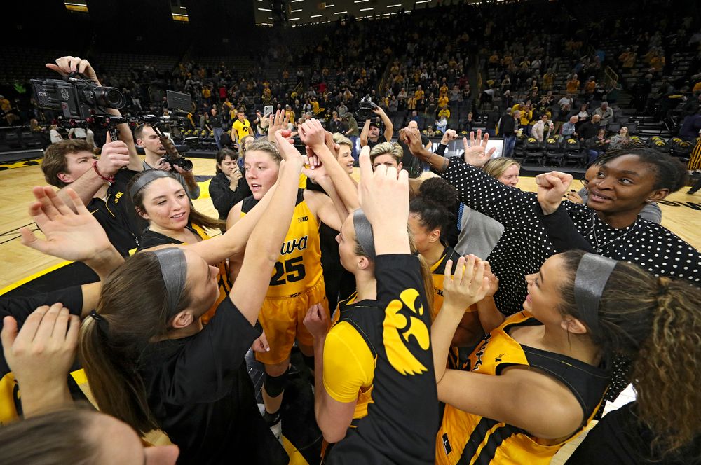 The Hawkeyes huddle after winning their game at Carver-Hawkeye Arena in Iowa City on Thursday, January 23, 2020. (Stephen Mally/hawkeyesports.com)