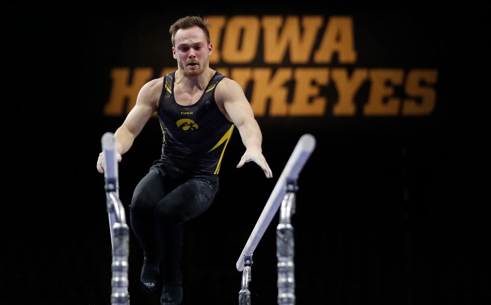 Iowa's Dylan Ellsworth competes on the bars