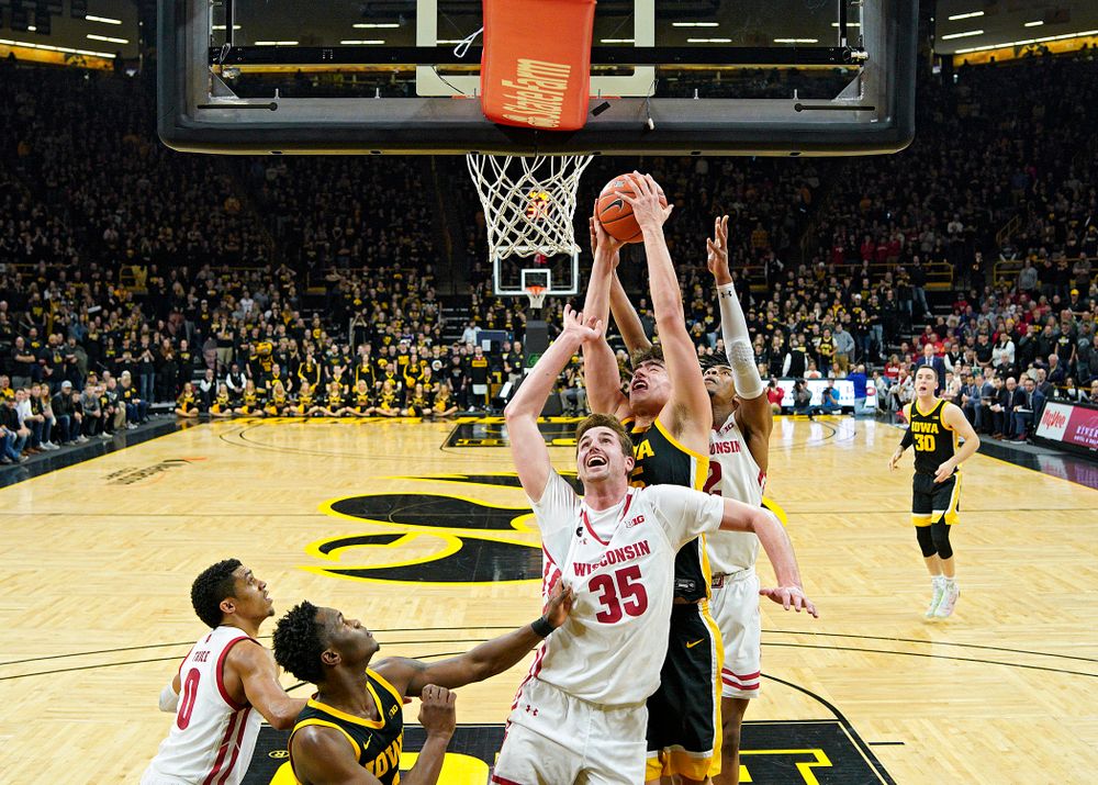 Iowa Hawkeyes center Luka Garza (55) pulls in a rebound during the second half of their game at Carver-Hawkeye Arena in Iowa City on Monday, January 27, 2020. (Stephen Mally/hawkeyesports.com)