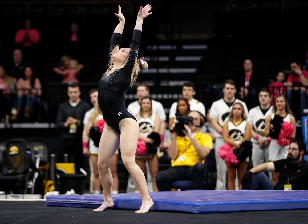 Iowa's Charlotte Sullivan competes on the floor 