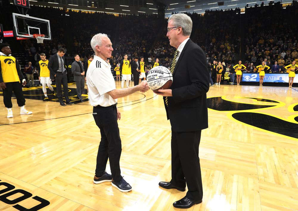Iowa Hawkeyes head coach Fran McCaffery presents Randy Larson a ceremonial ball for his years of service running the PrimeTime League before their game against the Ohio State Buckeyes Saturday, January 12, 2019 at Carver-Hawkeye Arena. (Brian Ray/hawkeyesports.com)