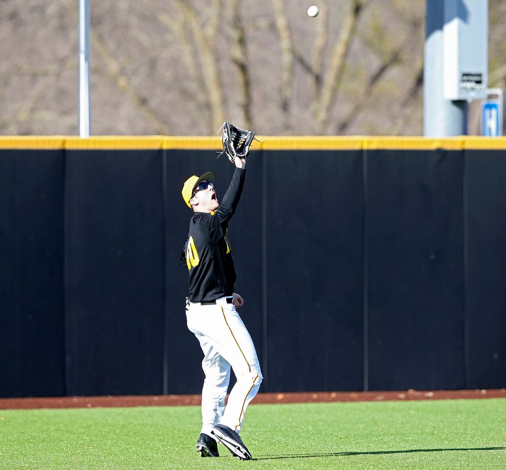 Iowa Hawkeyes left fielder Connor McCaffery (30) tracks down a fly ball for the final out of the ninth inning of their game against Illinois at Duane Banks Field in Iowa City on Saturday, Mar. 30, 2019. (Stephen Mally/hawkeyesports.com)