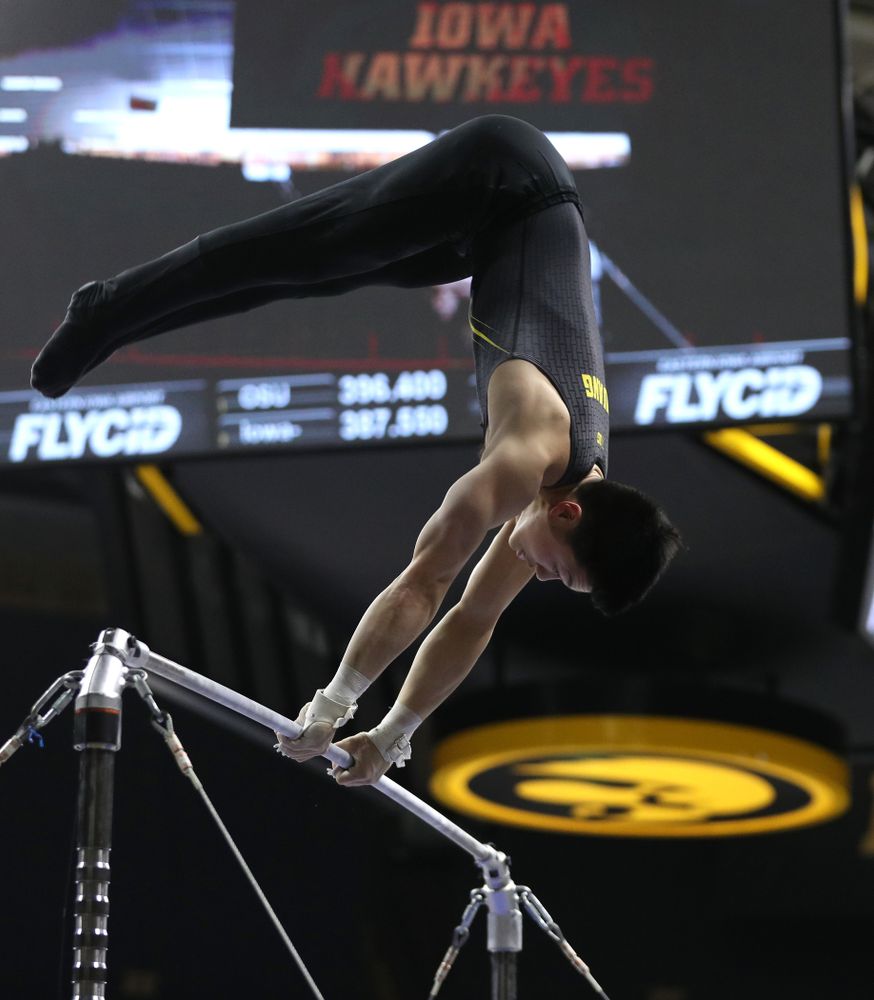 Iowa's Bennet Huang competes on the high bar against the Ohio State Buckeyes Saturday, March 16, 2019 at Carver-Hawkeye Arena.  (Brian Ray/hawkeyesports.com)