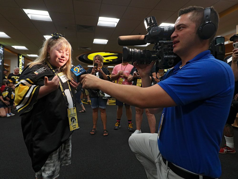Kid Captain Kendra Hines is interviewed in the Iowa locker room during Kids Day at Kinnick Stadium in Iowa City on Saturday, Aug 10, 2019. (Stephen Mally/hawkeyesports.com)