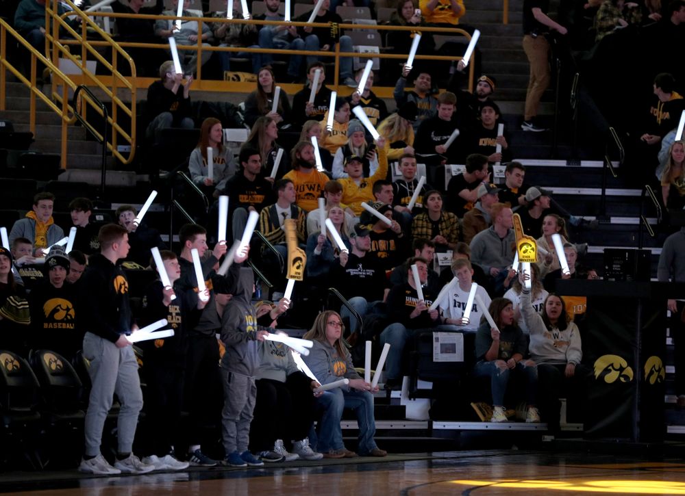 Fans wave glow sticks before the Iowa Hawkeyes game against the Michigan Wolverines Friday, January 17, 2020 at Carver-Hawkeye Arena. (Brian Ray/hawkeyesports.com)