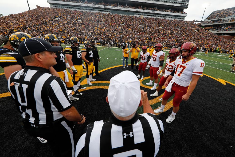 Iowa Hawkeyes captains defensive end Parker Hesse (40), quarterback Nate Stanley (4), offensive lineman Keegan Render (69), and fullback Brady Ross (36) stand for the coin toss against the Iowa State Cyclones Saturday, September 8, 2018 at Kinnick Stadium. (Brian Ray/hawkeyesports.com)