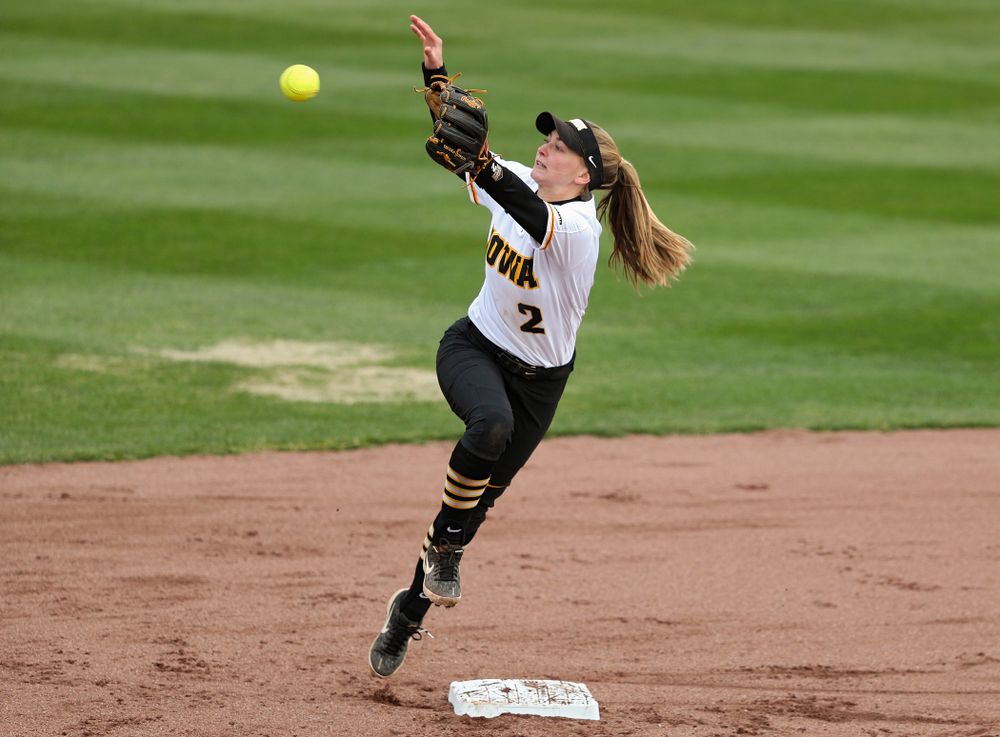 Iowa second baseman Aralee Bogar (2) pulls in a throw during the first inning of their game against Illinois at Pearl Field in Iowa City on Friday, Apr. 12, 2019. (Stephen Mally/hawkeyesports.com)