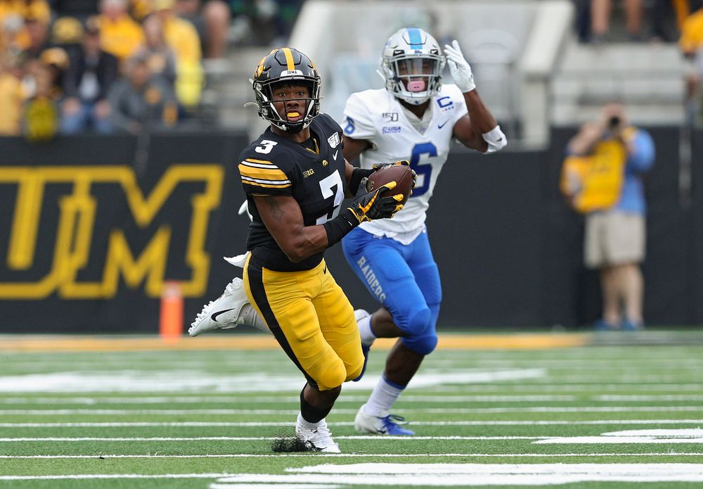 Iowa Hawkeyes wide receiver Tyrone Tracy Jr. (3) pulls in a pass after it bounced off the hands of Middle Tennessee State free safety Reed Blankenship (12) during the first quarter of their game at Kinnick Stadium in Iowa City on Saturday, Sep 28, 2019. (Stephen Mally/hawkeyesports.com)