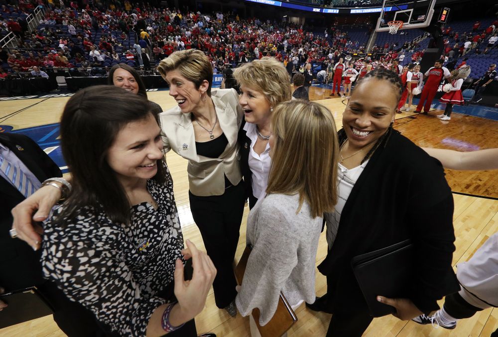Iowa Hawkeyes head coach Lisa Bluder, associate head coaches Jan Jensen, and Jenni Fitzgerald, and assistant coach Raina Harmon against the NC State Wolfpack in the regional semi-final of the 2019 NCAA Women's College Basketball Tournament Saturday, March 30, 2019 at Greensboro Coliseum in Greensboro, NC.(Brian Ray/hawkeyesports.com)