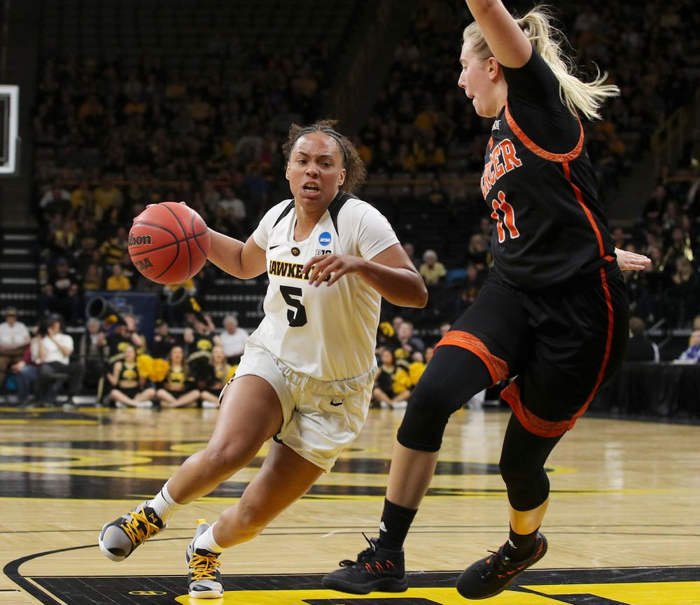 Iowa Hawkeyes guard Alexis Sevillian (5) drives in during the first round of the 2019 NCAA Women's Basketball Tournament at Carver Hawkeye Arena in Iowa City on Friday, Mar. 22, 2019. (Stephen Mally for hawkeyesports.com)