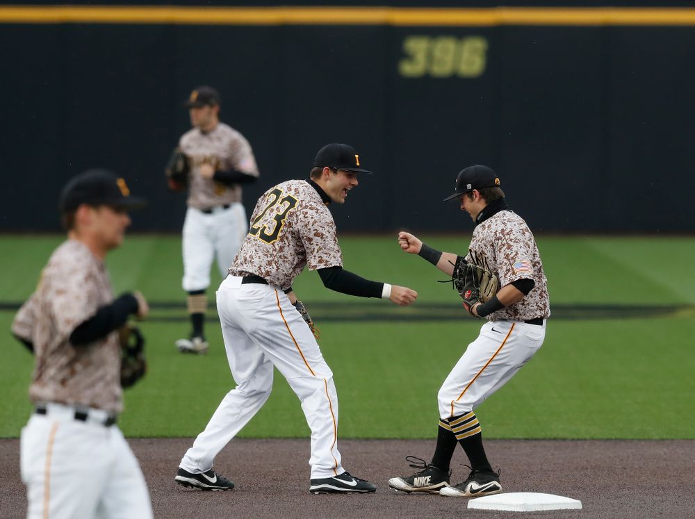 Iowa Hawkeyes infielder Mitchell Boe (4) and infielder Kyle Crowl (23) during a double header against the Indiana Hoosiers Friday, March 23, 2018 at Duane Banks Field. (Brian Ray/hawkeyesports.com)
