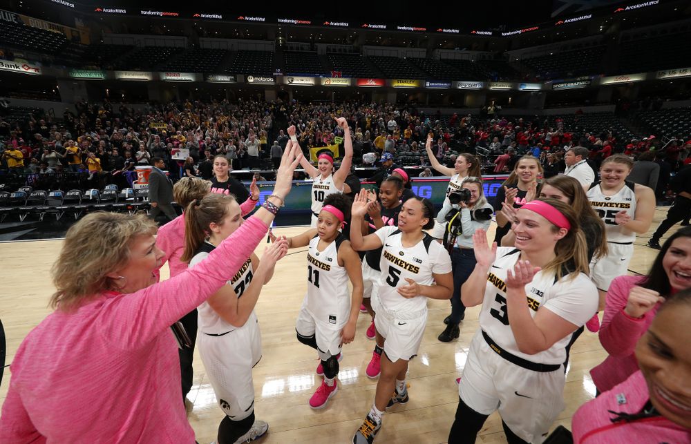 The Iowa Hawkeyes celebrate their win against the Rutgers Scarlet Knights in the semi-finals of the Big Ten Tournament Saturday, March 9, 2019 at Bankers Life Fieldhouse in Indianapolis, Ind. (Brian Ray/hawkeyesports.com)